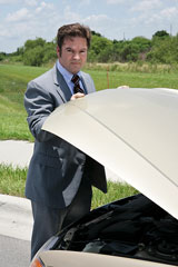 business person with car trouble
